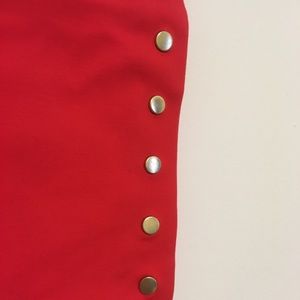 Bright red pencil skirt with gold buttons